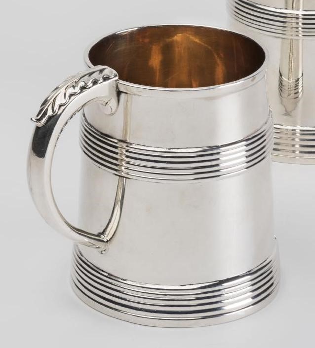A PAIR OF GEORGE III SILVER MUGS Image