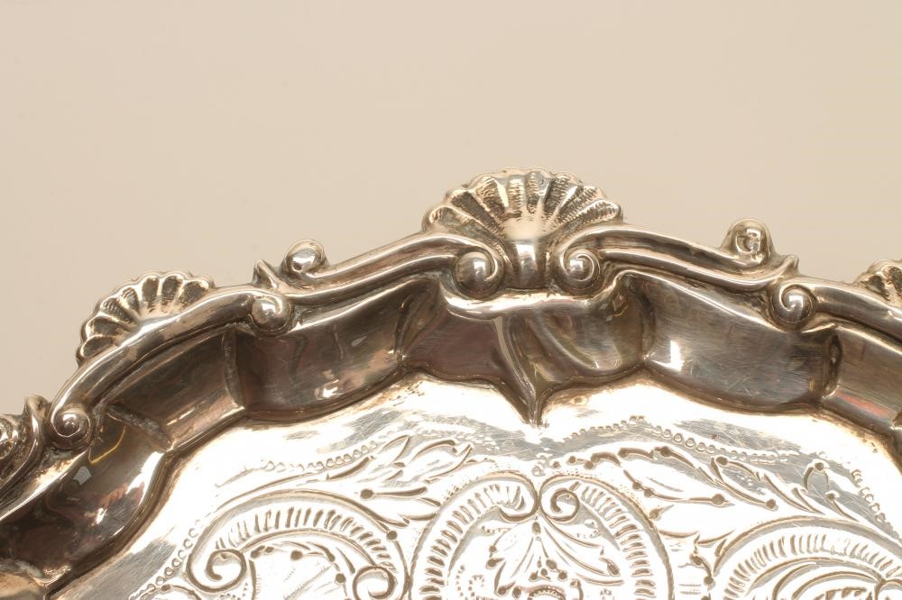 A GEORGE III SMALL SILVER SALVER Image