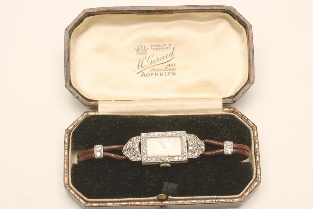 AN ART DECO DIAMOND AND PLATINUM COCKTAIL WATCH Image