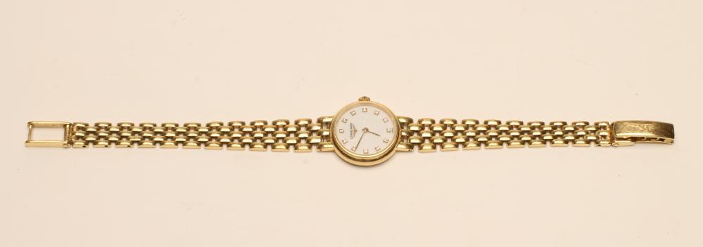A LADY'S LONGINES 18CT GOLD WRISTWATCH Image