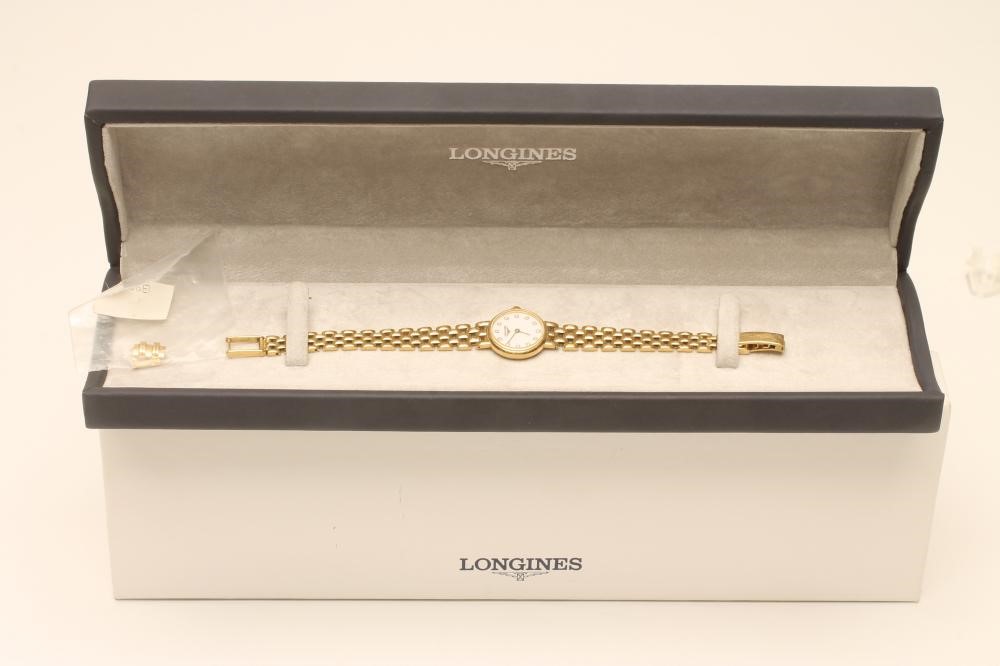 A LADY'S LONGINES 18CT GOLD WRISTWATCH Image