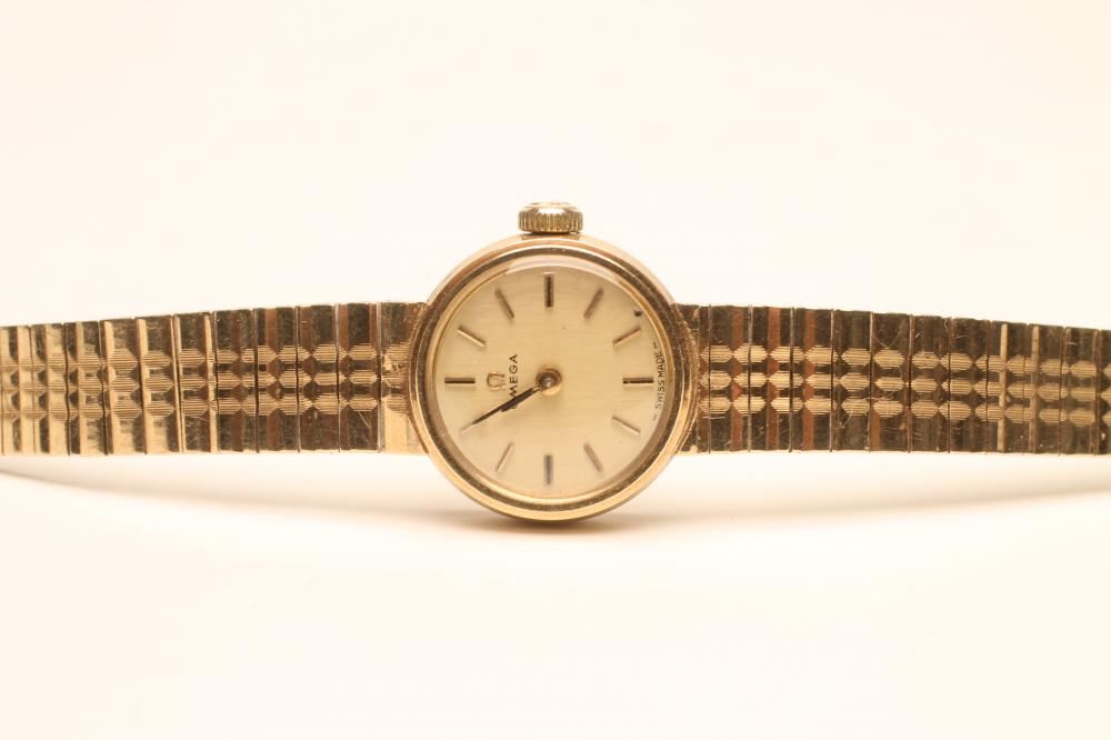 A LADY'S 9CT GOLD OMEGA WRISTWATCH Image