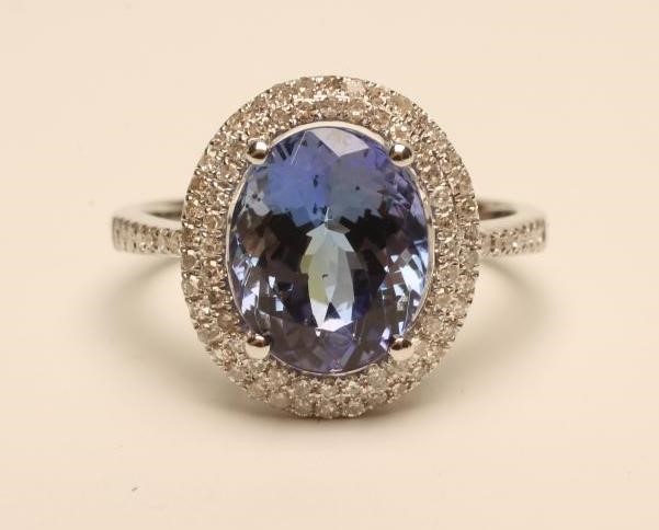 A TANZANITE AND DIAMOND CLUSTER RING Image