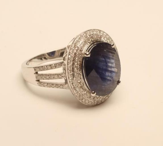 A SAPPHIRE AND DIAMOND CLUSTER RING Image