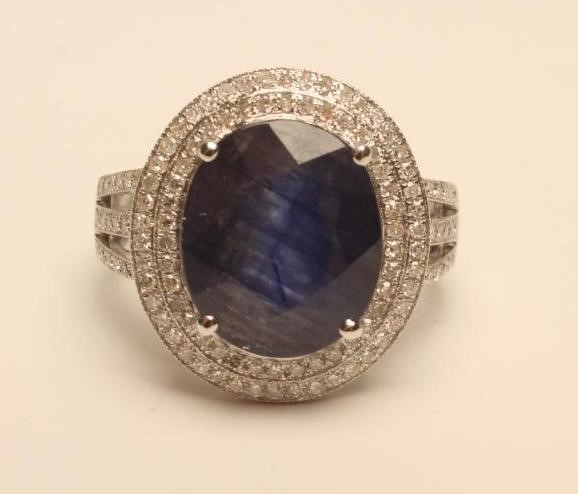 A SAPPHIRE AND DIAMOND CLUSTER RING Image