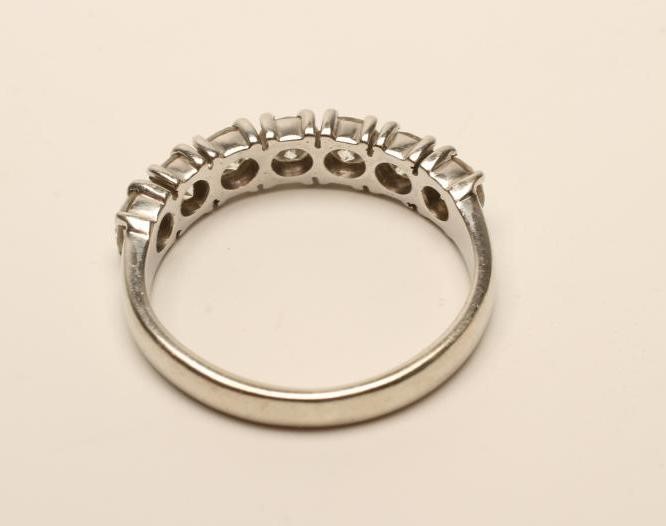 A DIAMOND HALF HOOP RING Image
