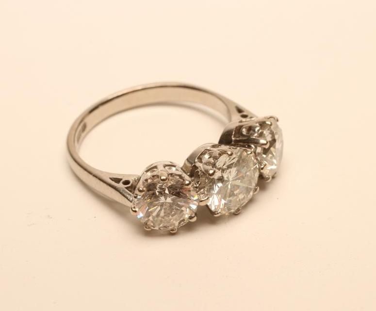 A THREE STONE DIAMOND RING Image