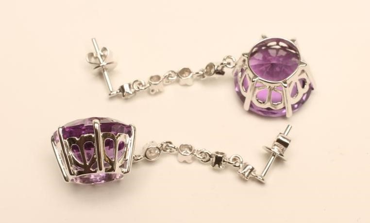 A PAIR OF AMETHYST AND DIAMOND DROP EAR STUDS Image