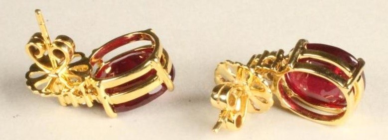 A PAIR OF RUBY EAR STUDS to match the previous lot Image
