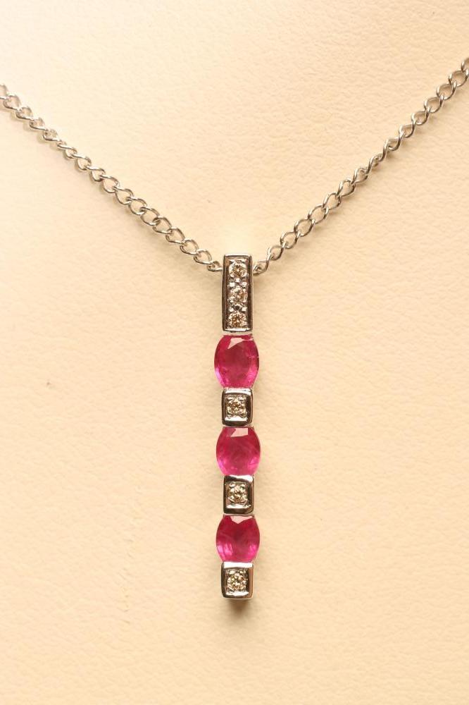A RUBY AND DIAMOND LINE PENDANT Image