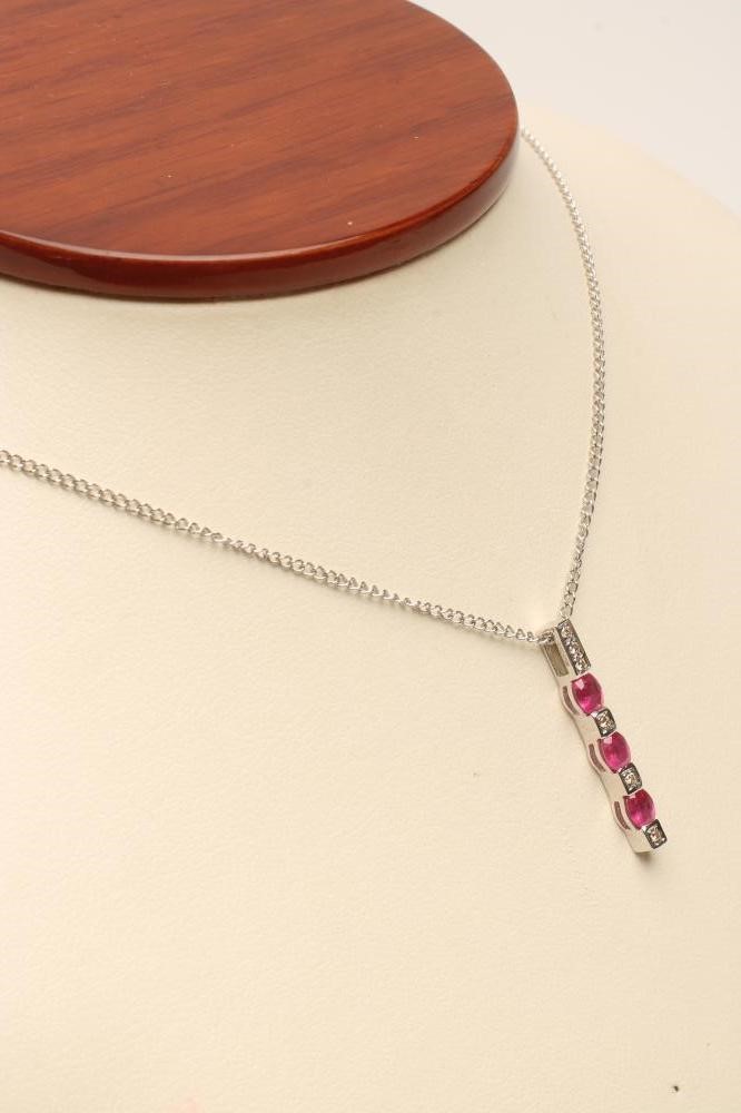 A RUBY AND DIAMOND LINE PENDANT Image