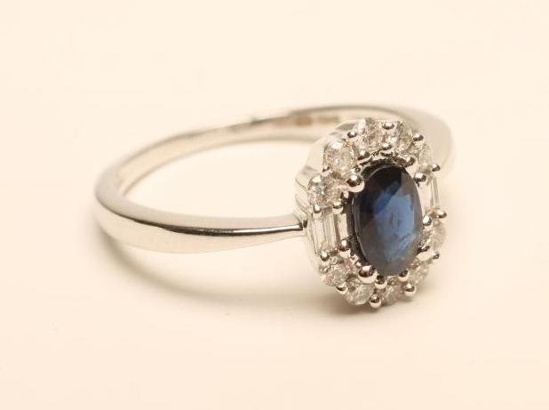 A SAPPHIRE AND DIAMOND CLUSTER RING Image