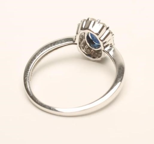 A SAPPHIRE AND DIAMOND CLUSTER RING Image