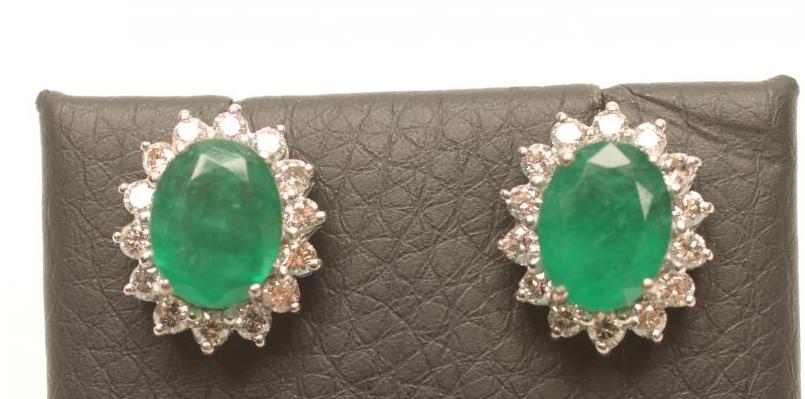 A PAIR OF EMERALD AND DIAMOND CLUSTER EAR STUDS Image