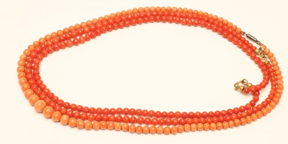 A PAIR OF VICTORIAN POLISHED CORAL BEAD NECKLACES Image