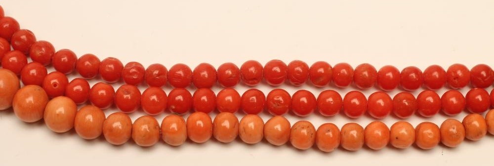 A PAIR OF VICTORIAN POLISHED CORAL BEAD NECKLACES Image