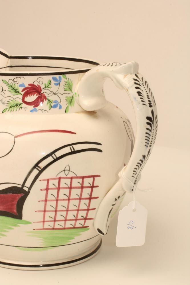 A DOCUMENTARY PEARLWARE DUTCH SHAPE JUG Image