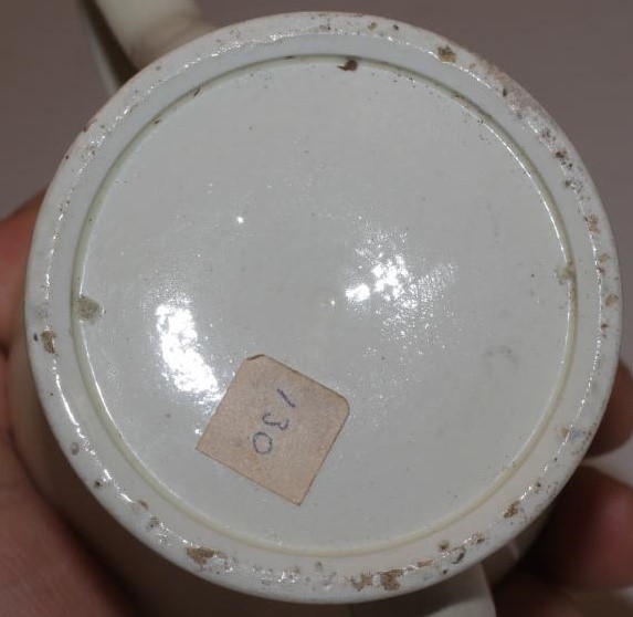 A CREAMWARE ROSEWATER SPRINKLER AND COVER Image