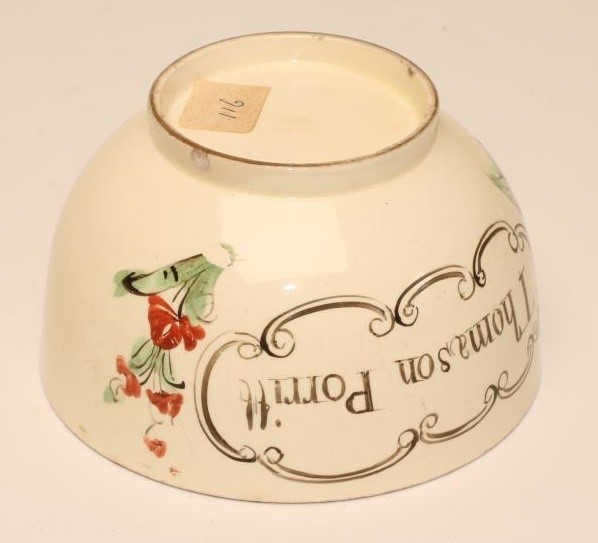 A DOCUMENTARY CREAMWARE TEABOWL AND SAUCER Image