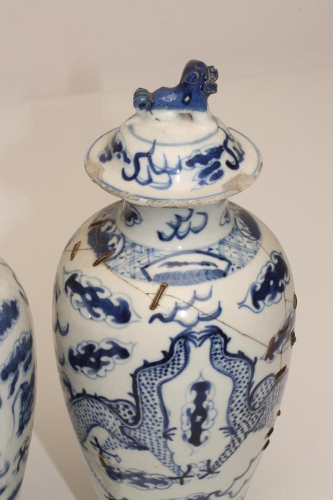 A PAIR OF CHINESE PORCELAIN VASES AND COVERS Image