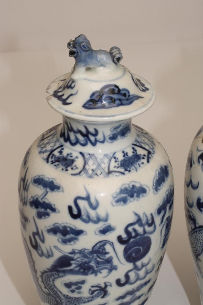 A PAIR OF CHINESE PORCELAIN VASES AND COVERS Image