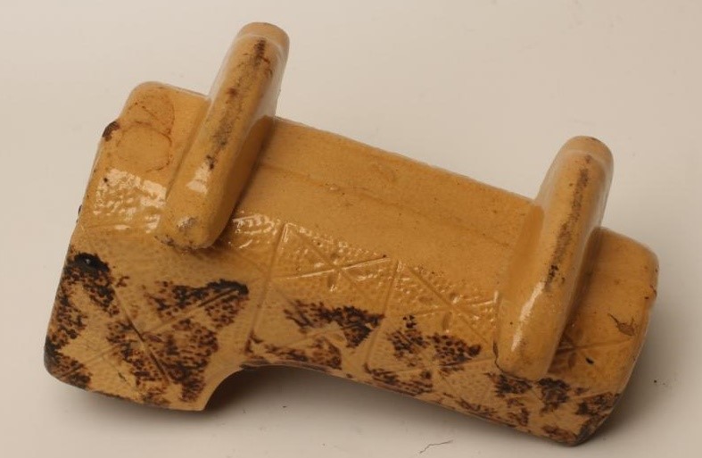 AN EARTHENWARE CRADLE Image