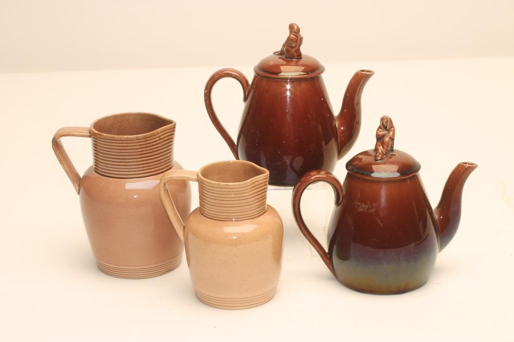 TWO GRADUATED ROCKINGHAM EARTHENWARE JUGS Image