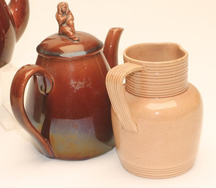 TWO GRADUATED ROCKINGHAM EARTHENWARE JUGS Image