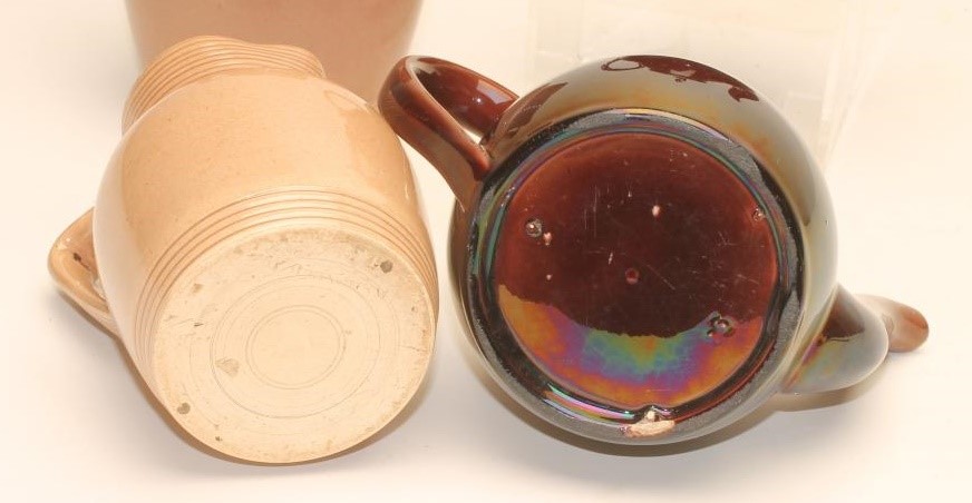 TWO GRADUATED ROCKINGHAM EARTHENWARE JUGS Image