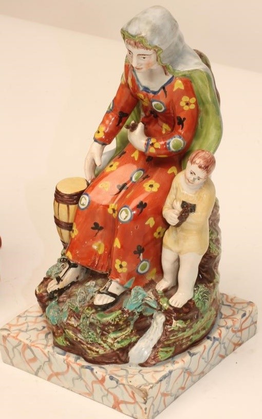 A STAFFORDSHIRE PEARLWARE FIGURE Image
