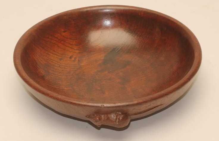 A ROBERT THOMPSON OAK BOWL of shallow circular form with plain interior Image
