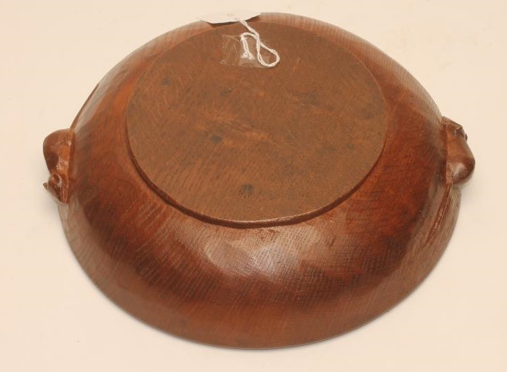 A ROBERT THOMPSON OAK BOWL of shallow circular form with plain interior Image