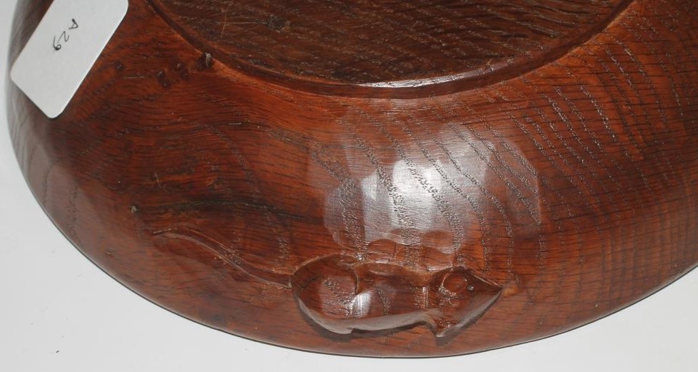 A ROBERT THOMPSON OAK BOWL of shallow circular form with plain interior Image