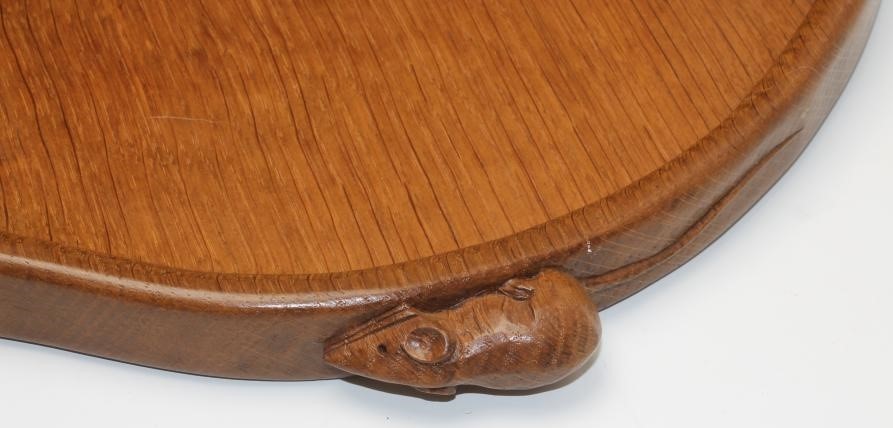 A ROBERT THOMPSON ADZED OAK TRAY of kidney form with two carved mouse trademark lug handles Image