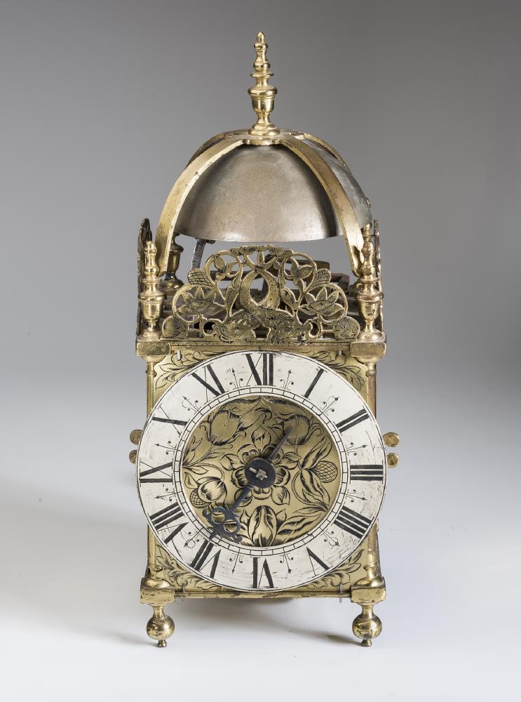 AN ENGLISH BRASS HOOK AND SPIKE LANTERN CLOCK Image