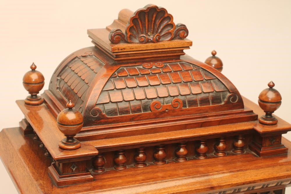 A GERMAN WALNUT CASED MANTEL CLOCK Image