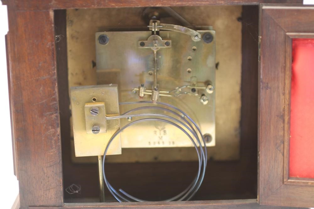 A GERMAN WALNUT CASED MANTEL CLOCK Image