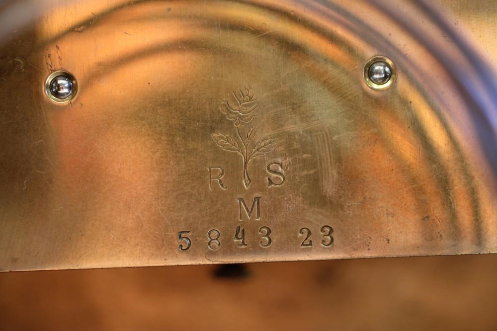 A GERMAN WALNUT CASED MANTEL CLOCK Image