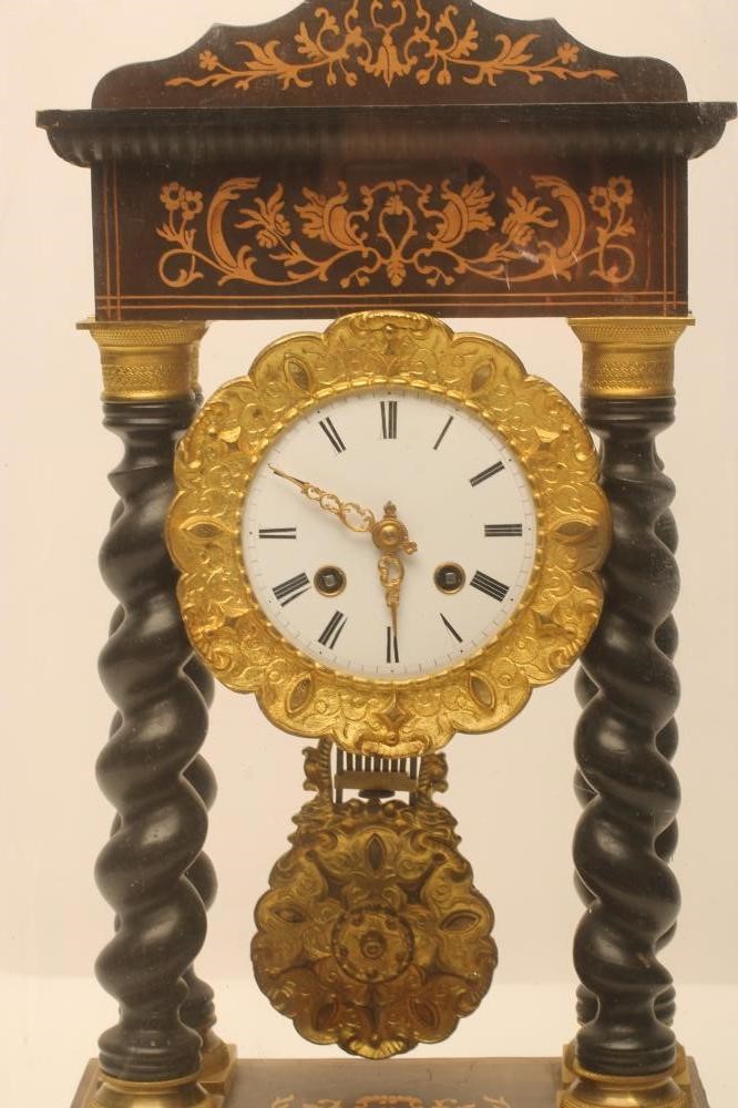 A FRENCH EBONISED PORTICO CLOCK Image