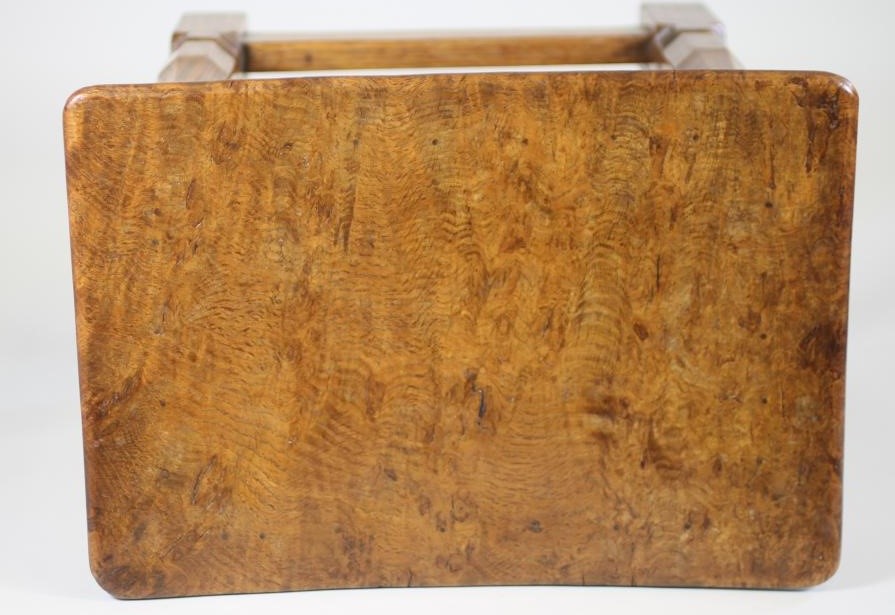 A ROBERT THOMPSON ADZED OAK STOOL of rounded oblong form Image