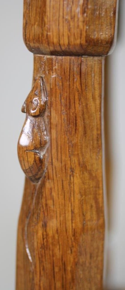 A ROBERT THOMPSON ADZED OAK STOOL of rounded oblong form Image