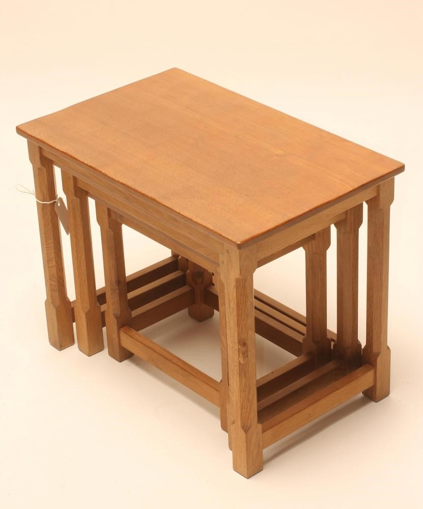 A ROBERT THOMPSON ADZED OAK NEST OF TABLES of oblong form Image
