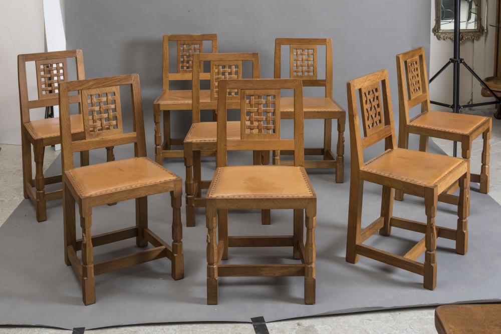 A SET OF EIGHT ROBERT THOMPSON OAK DINING CHAIRS Image