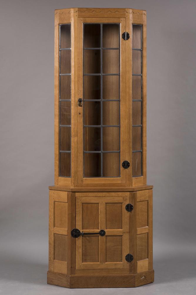A ROBERT THOMPSON ADZED OAK STANDING CORNER CUPBOARD to match the previous lot Image