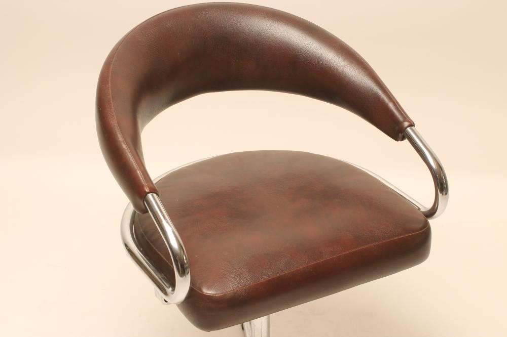 A CHROME FRAMED AND BROWN LEATHER SWIVEL CHAIR Image