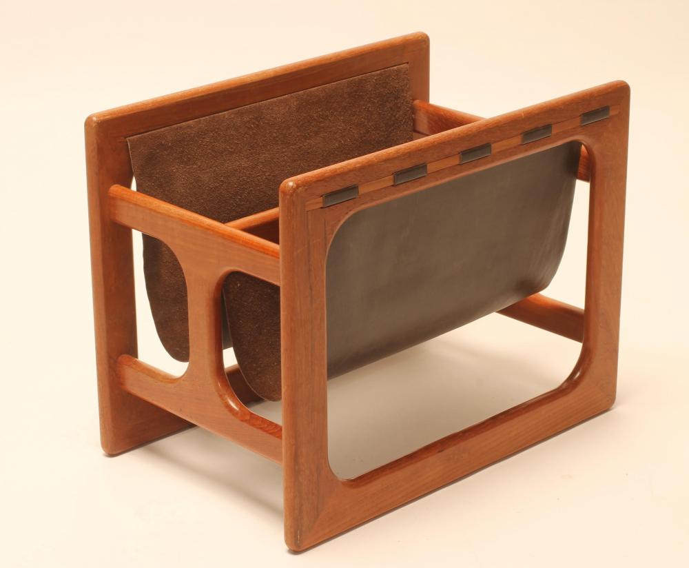 A TEAK AND BROWN LEATHER MAGAZINE RACK of open frame oblong form with central division Image