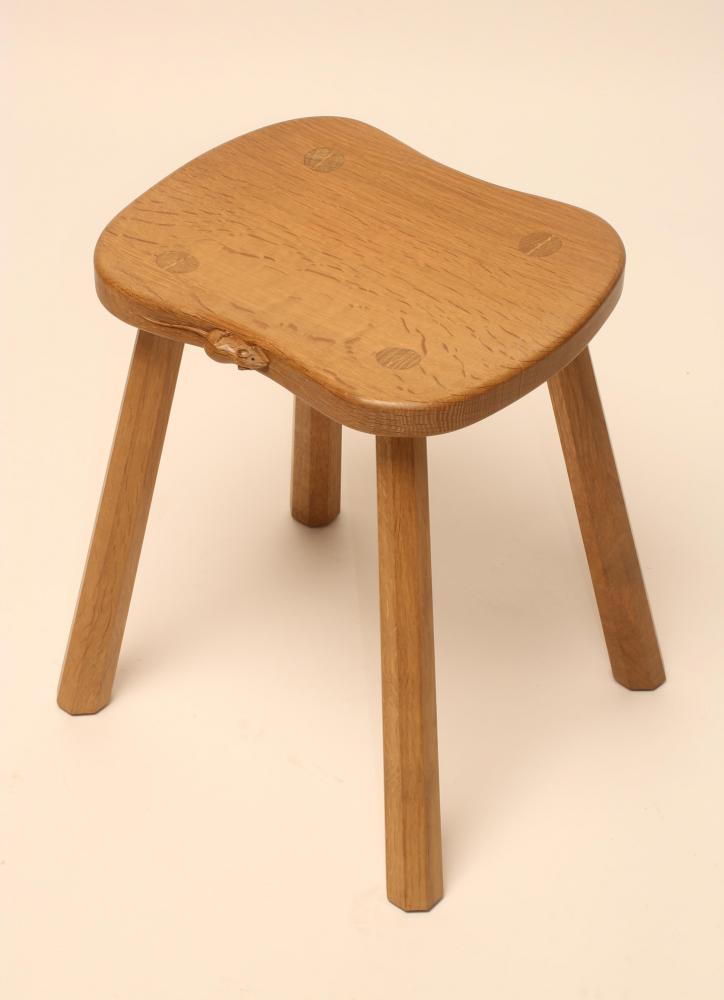 A ROBERT THOMPSON ADZED OAK STOOL of waisted rounded oblong form Image