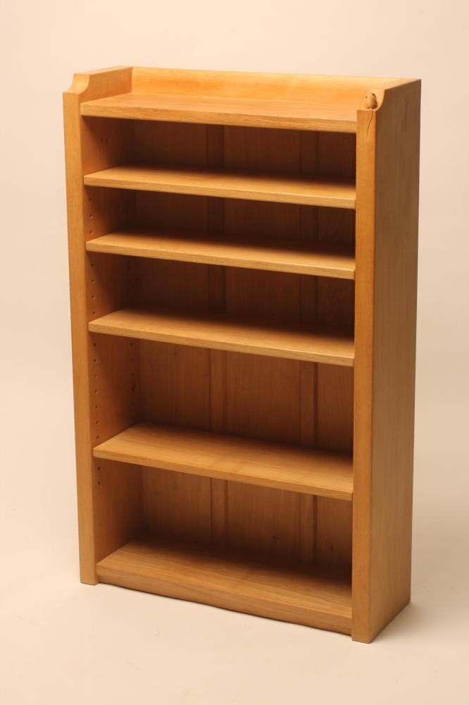 A ROBERT THOMPSON OAK OPEN BOOKCASE of oblong form with galleried surmount and adjustable shelving Image