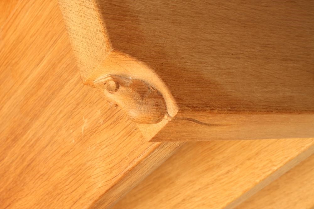 A ROBERT THOMPSON OAK OPEN BOOKCASE of oblong form with galleried surmount and adjustable shelving Image
