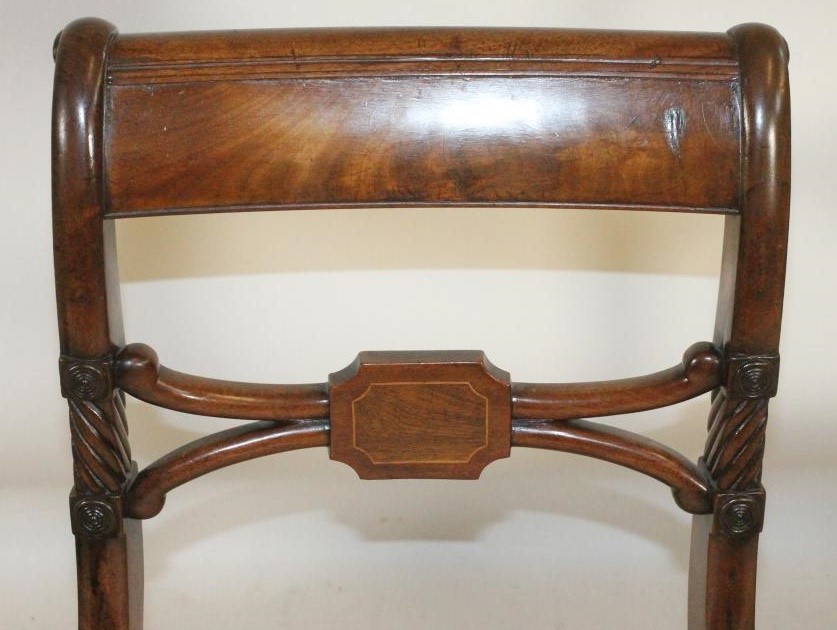 A SET OF FIVE REGENCY MAHOGANY DINING CHAIRS including an elbow chair Image